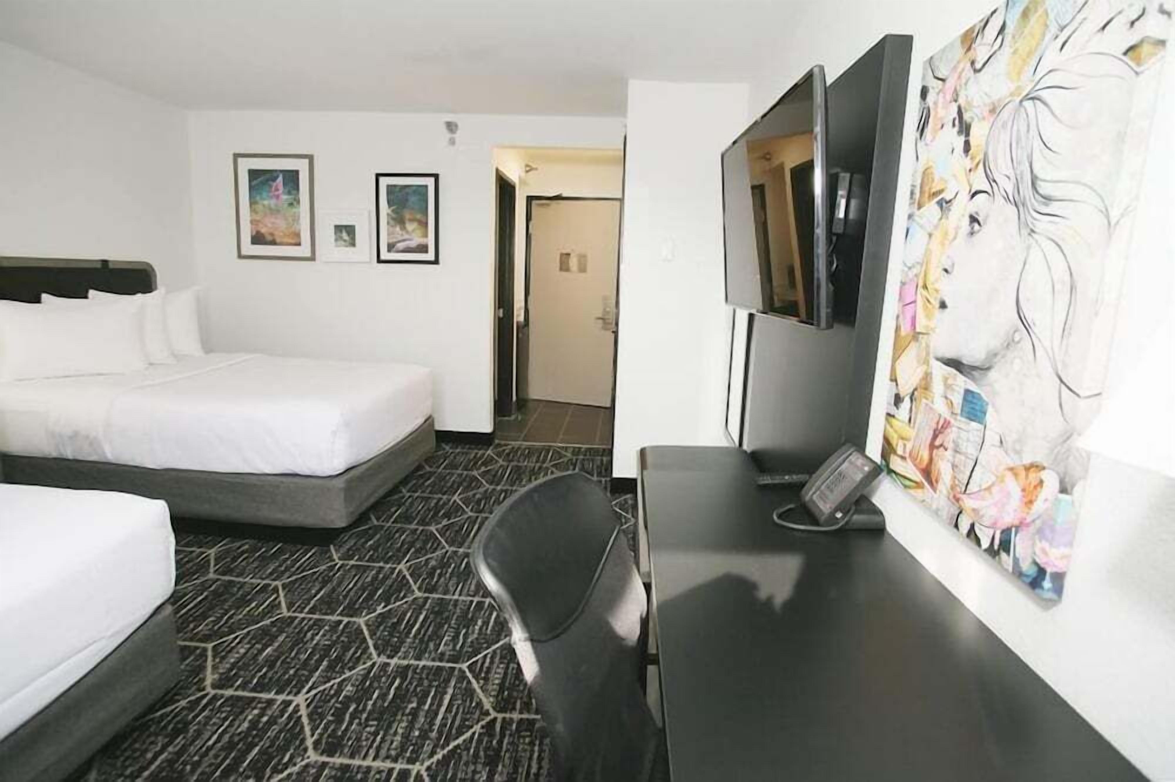 Premium bedding, desk, laptop workspace, iron/ironing board