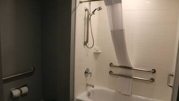 A bathroom with a bathtub, a shower, and a toilet.