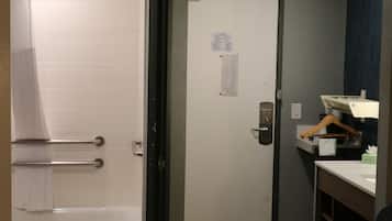 A bathroom with a bathtub, a shower, and a toilet.