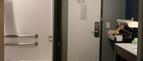 A bathroom with a bathtub, a shower, and a toilet.