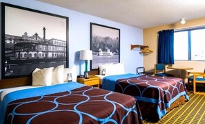 A hotel room with two beds, a desk, a chair, a lamp, and two framed pictures on the wall. - Super 8 by Wyndham Burlington (Burlington)