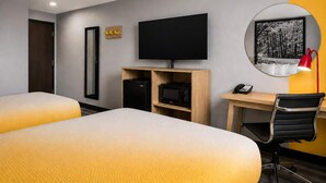A hotel room with two beds, a desk, a flat-screen TV, a telephone, and a mirror. - Super 8 by Wyndham Champaign (Champaign)