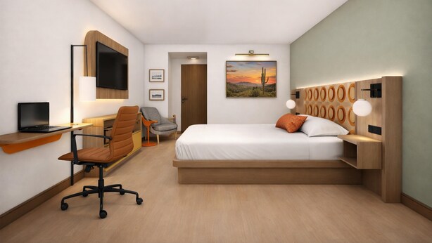 A hotel room with a bed, desk, chair, and a television. - Hotel Embarque, Unscripted By Hyatt (Phoenix)