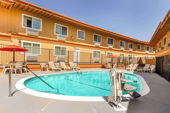 Seasonal outdoor pool, open 9:00 AM to 9:00 PM, sun loungers