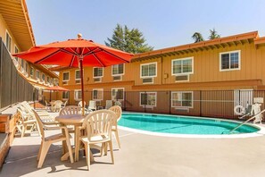 Seasonal outdoor pool, open 9:00 AM to 9:00 PM, pool loungers