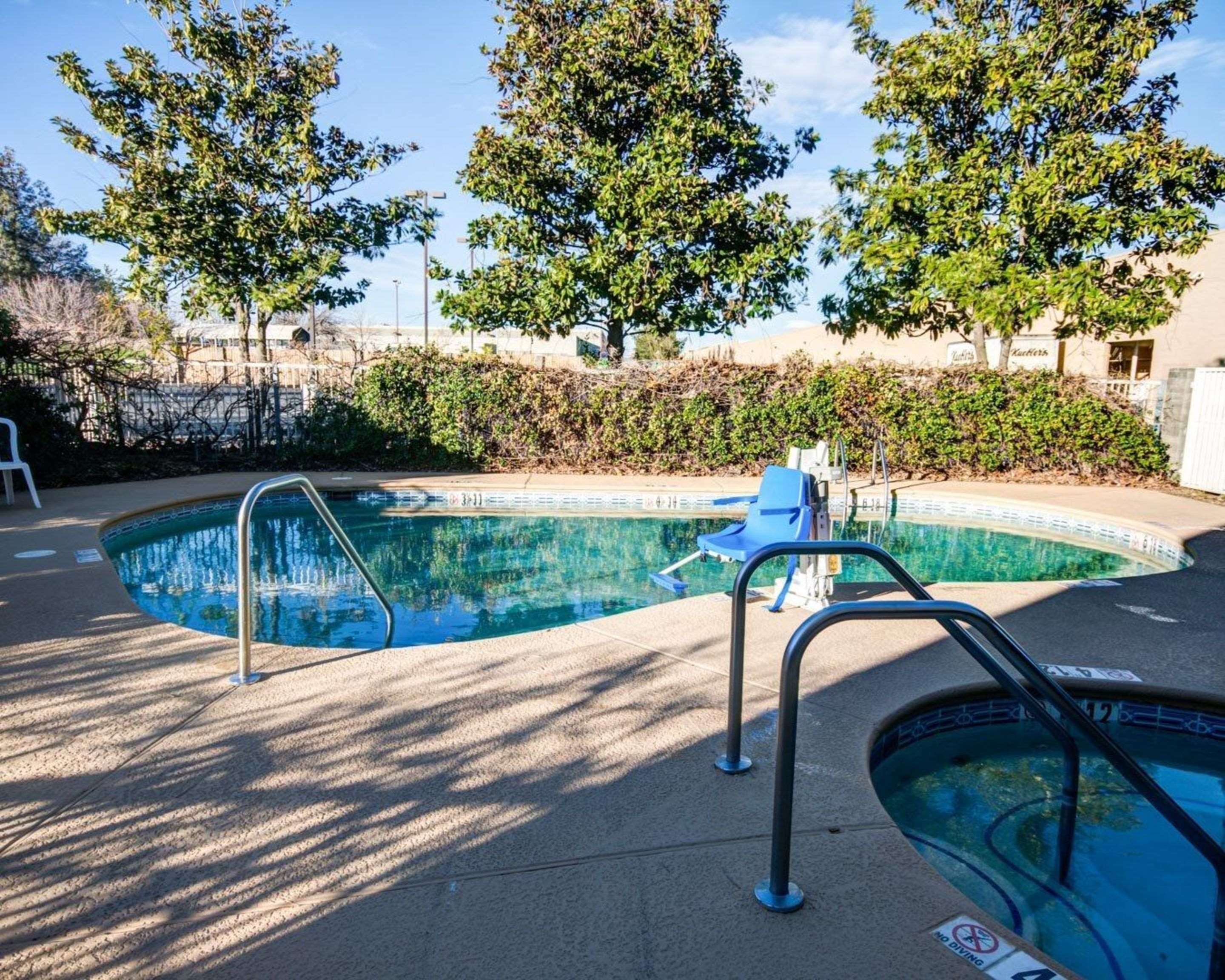 Seasonal outdoor pool, open 9:00 AM to 9:00 PM, pool umbrellas
