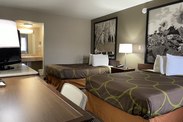 Desk, laptop workspace, blackout drapes, iron/ironing board