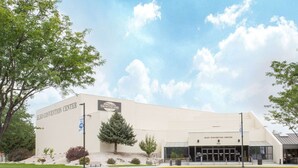 A large, modern building with a sign reading "Elko Convention Center". - Super 8 by Wyndham Elko (Elko)