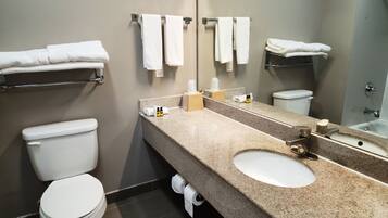 Combined shower/bathtub, towels, soap, toilet paper