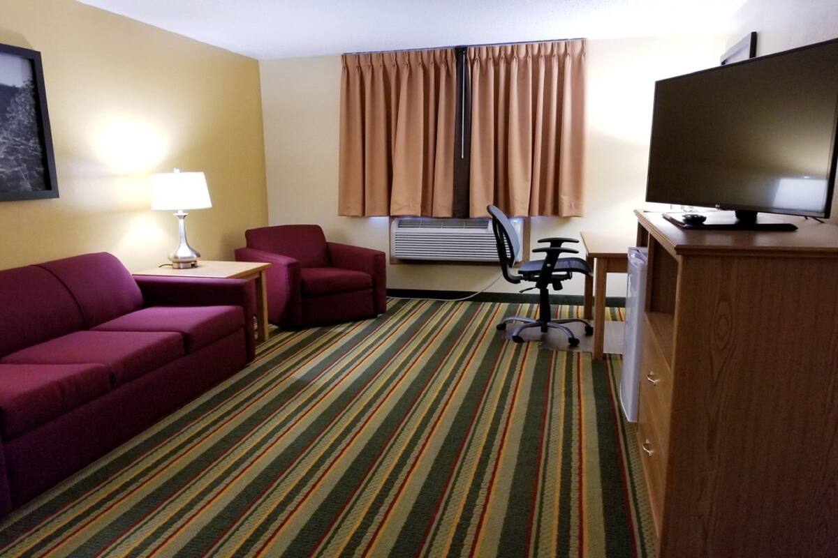 suite, 2 queen beds, non smoking (one-bedroom suite) | in-room safe, desk, iron/ironing board, free cots/infant beds