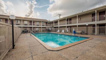 Seasonal outdoor pool, pool umbrellas, pool loungers