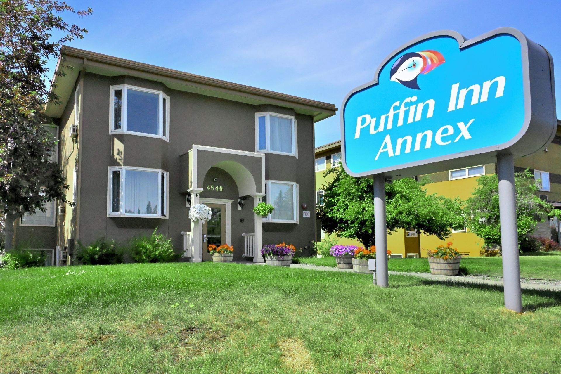 A building with a sign reading "Puffin Inn Annex" and a number "4540" above the entrance.