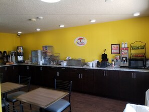 Enjoy a meal at this restaurant, where a breakfast area offers a coffee machine, cereal dispenser, and fresh fruit display.