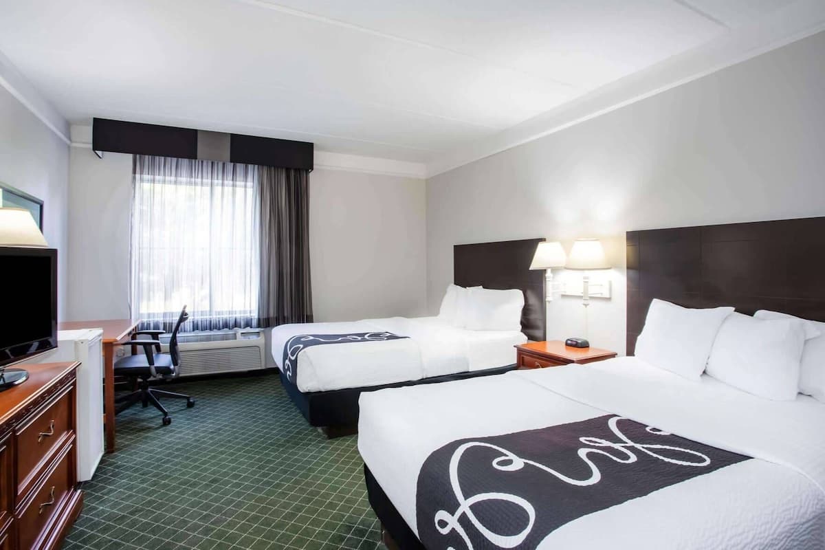 Pillowtop beds, desk, blackout drapes, iron/ironing board