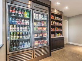A vending machine area with various beverages and snacks.