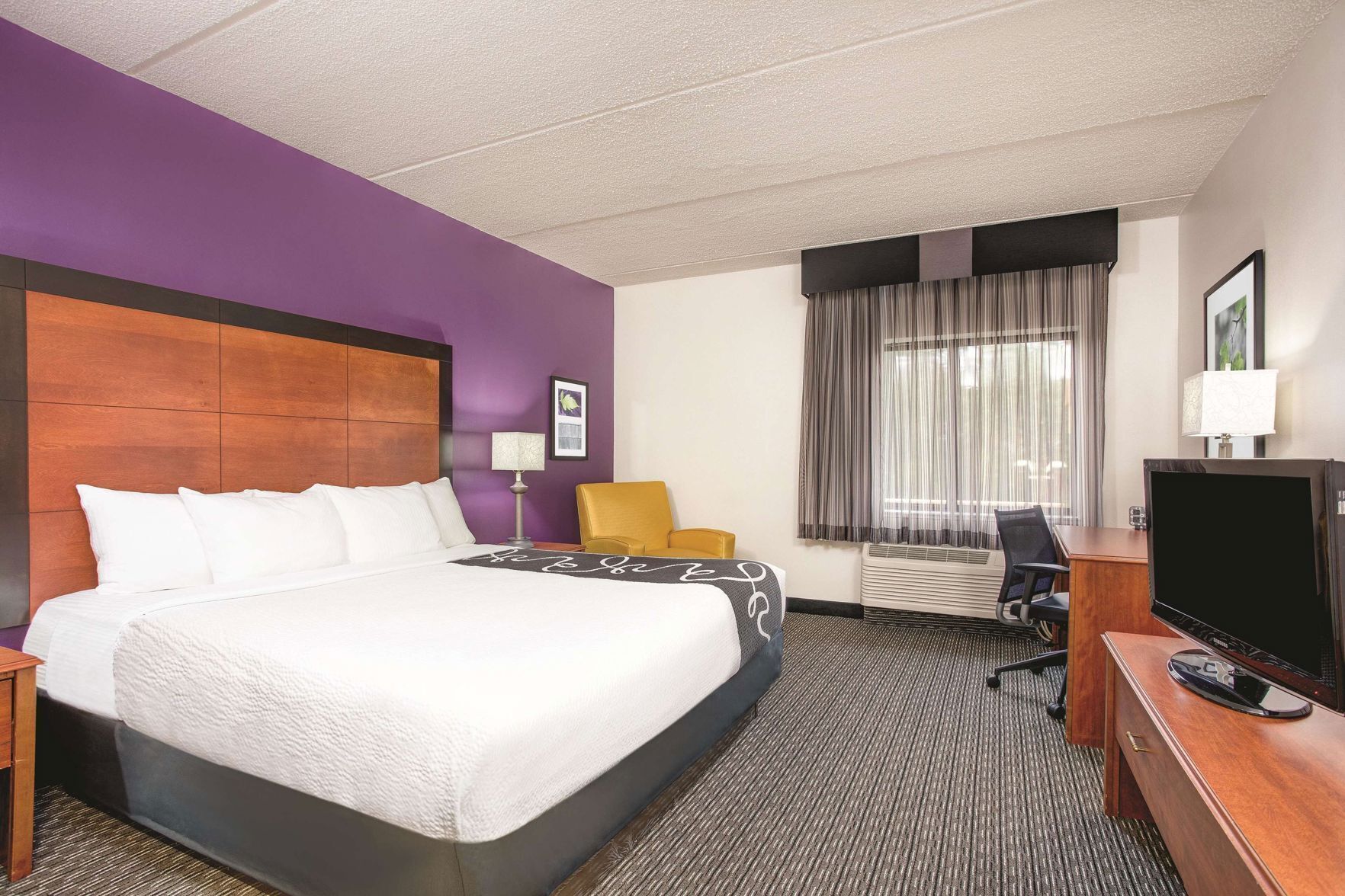 Premium bedding, desk, laptop workspace, iron/ironing board