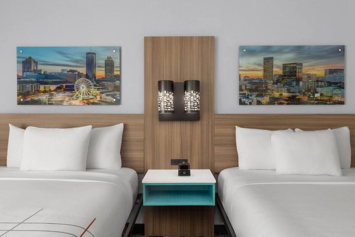 Premium bedding, desk, laptop workspace, iron/ironing board