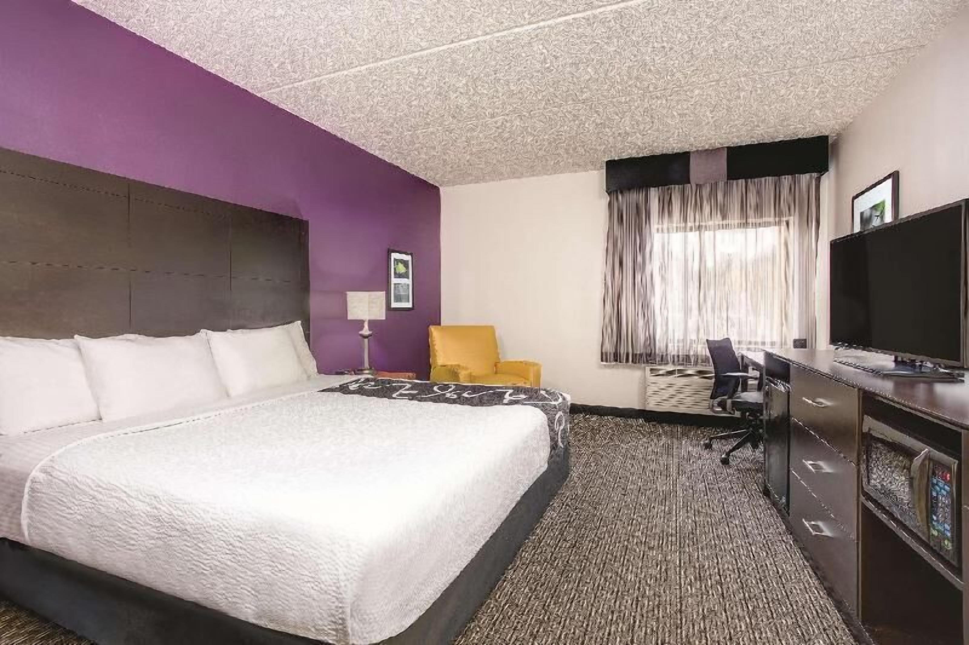 Premium bedding, desk, laptop workspace, iron/ironing board