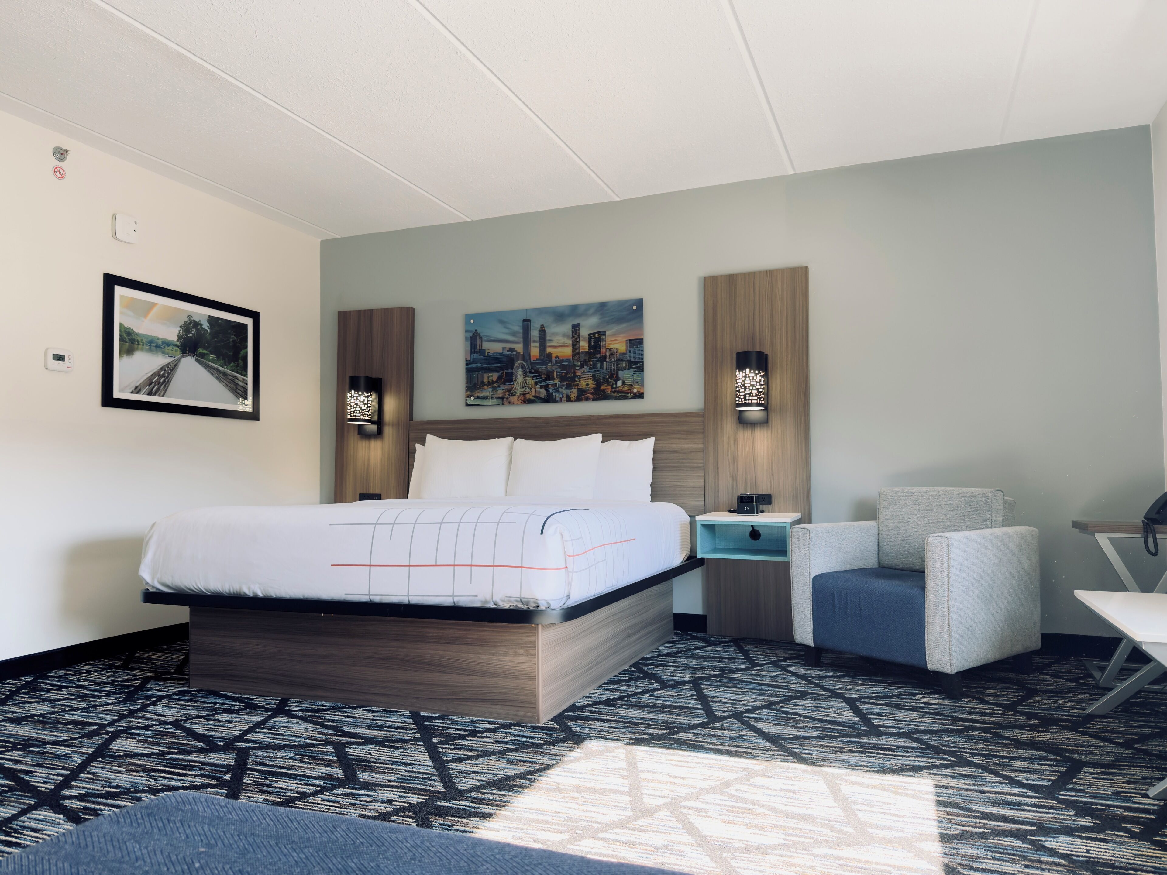 Premium bedding, desk, laptop workspace, iron/ironing board