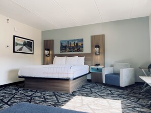 Premium bedding, desk, laptop workspace, iron/ironing board