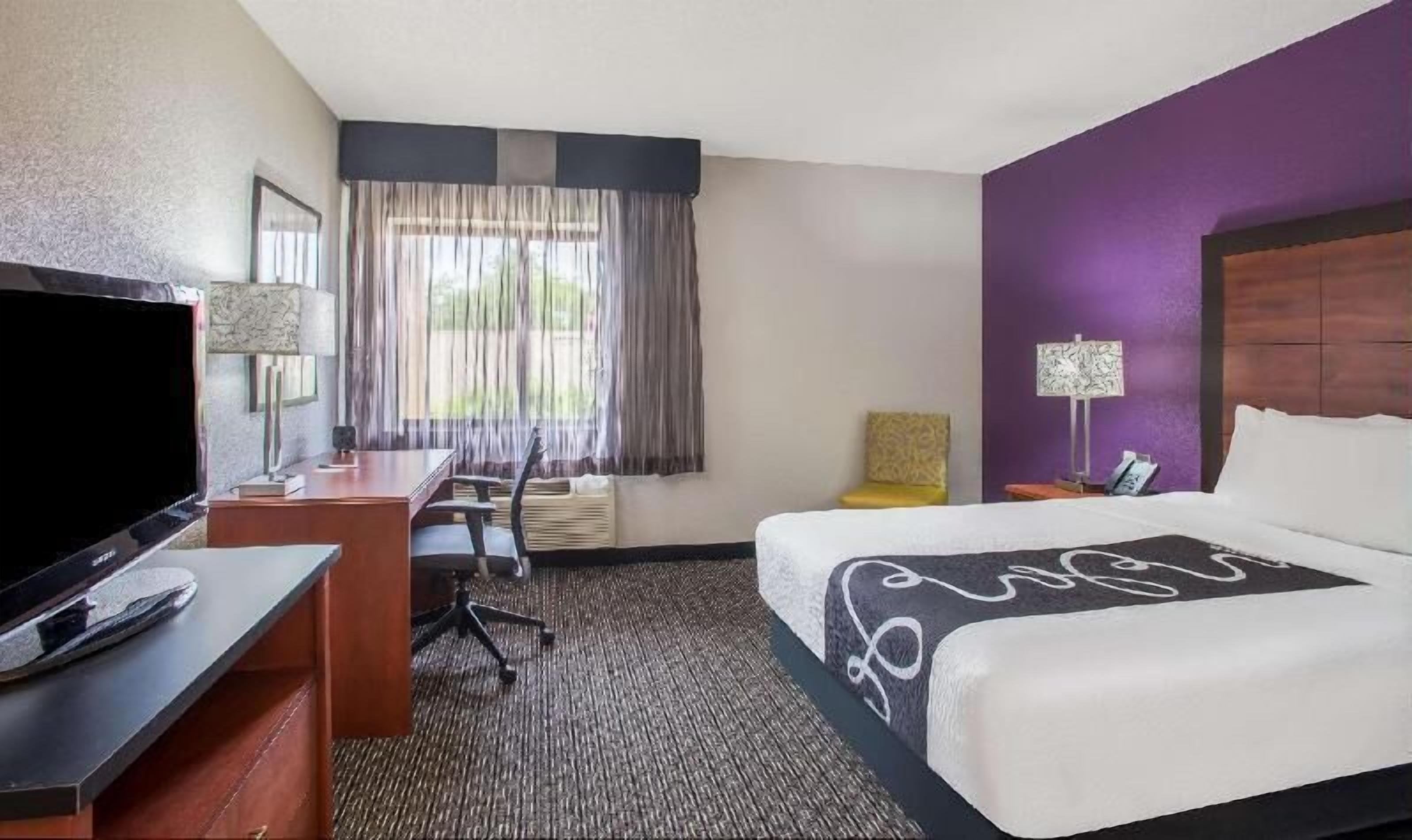 Premium bedding, desk, laptop workspace, iron/ironing board