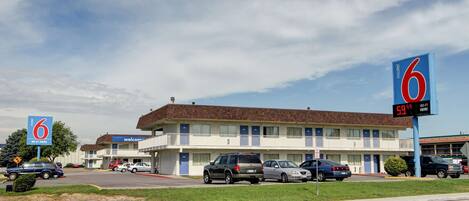 A motel with a clear sign indicating the price of $59.44.
