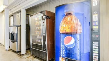 A vending machine with a Pepsi logo, a refrigerated display case, and a water dispenser.