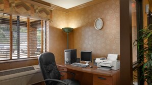 A home office with a desk, two monitors, a printer, and a chair. - Super 8 by Wyndham Peoria East (East Peoria)