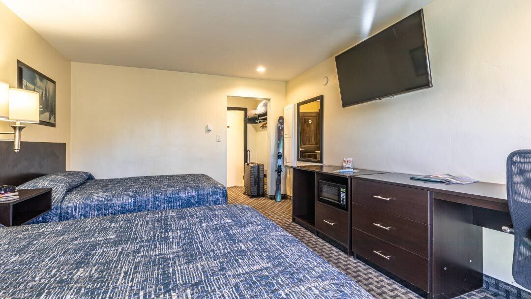 deluxe room, 2 queen beds | desk, blackout curtains, iron/ironing board, free wifi