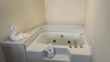 Suite, 1 King Bed, Non Smoking | Bathroom | Combined shower/tub, free toiletries, hair dryer, towels