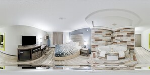Room, 1 King Bed, Jetted Tub | Desk, soundproofing, iron/ironing board, rollaway beds