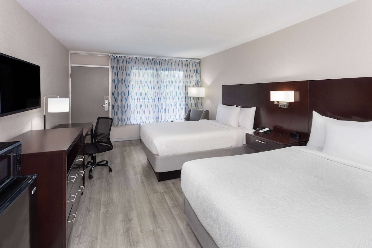 desk, laptop workspace, blackout curtains, iron/ironing board