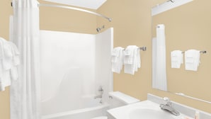 A modern bathroom with a bathtub, toilet, and sink. - Super 8 by Wyndham Columbus (Columbus)