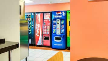 A vending area with Coca-Cola and Pepsi machines.