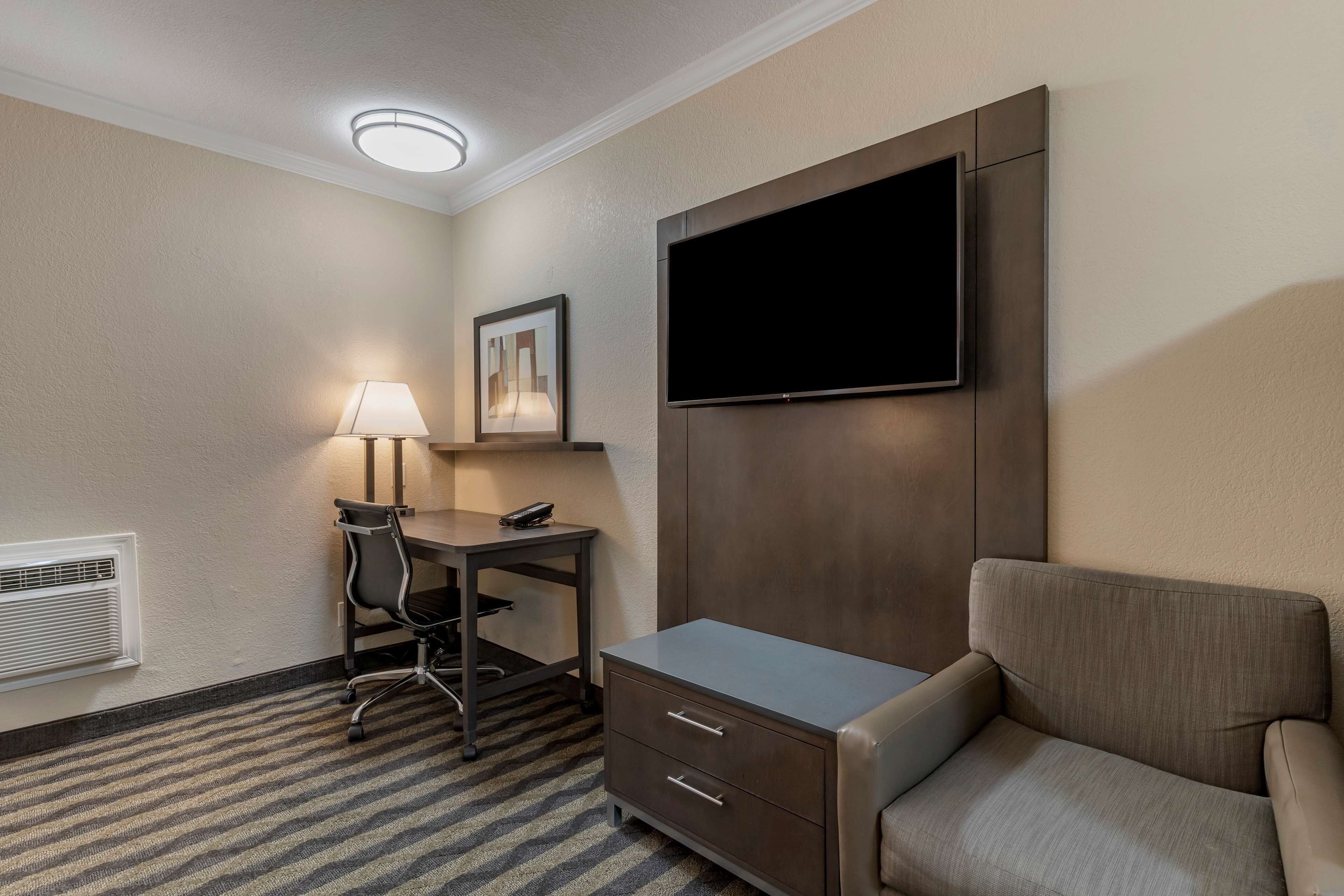 desk, laptop workspace, blackout curtains, iron/ironing board