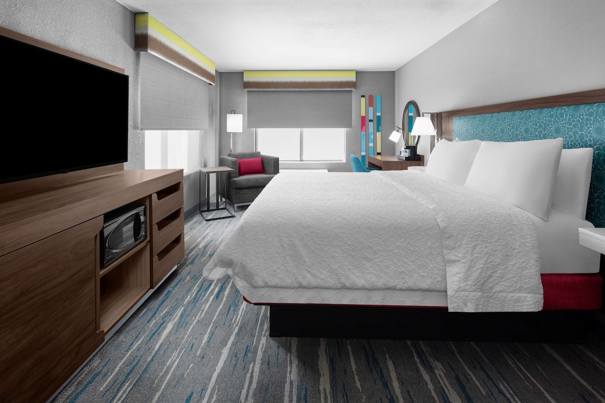 premium bedding, desk, blackout curtains, iron/ironing board