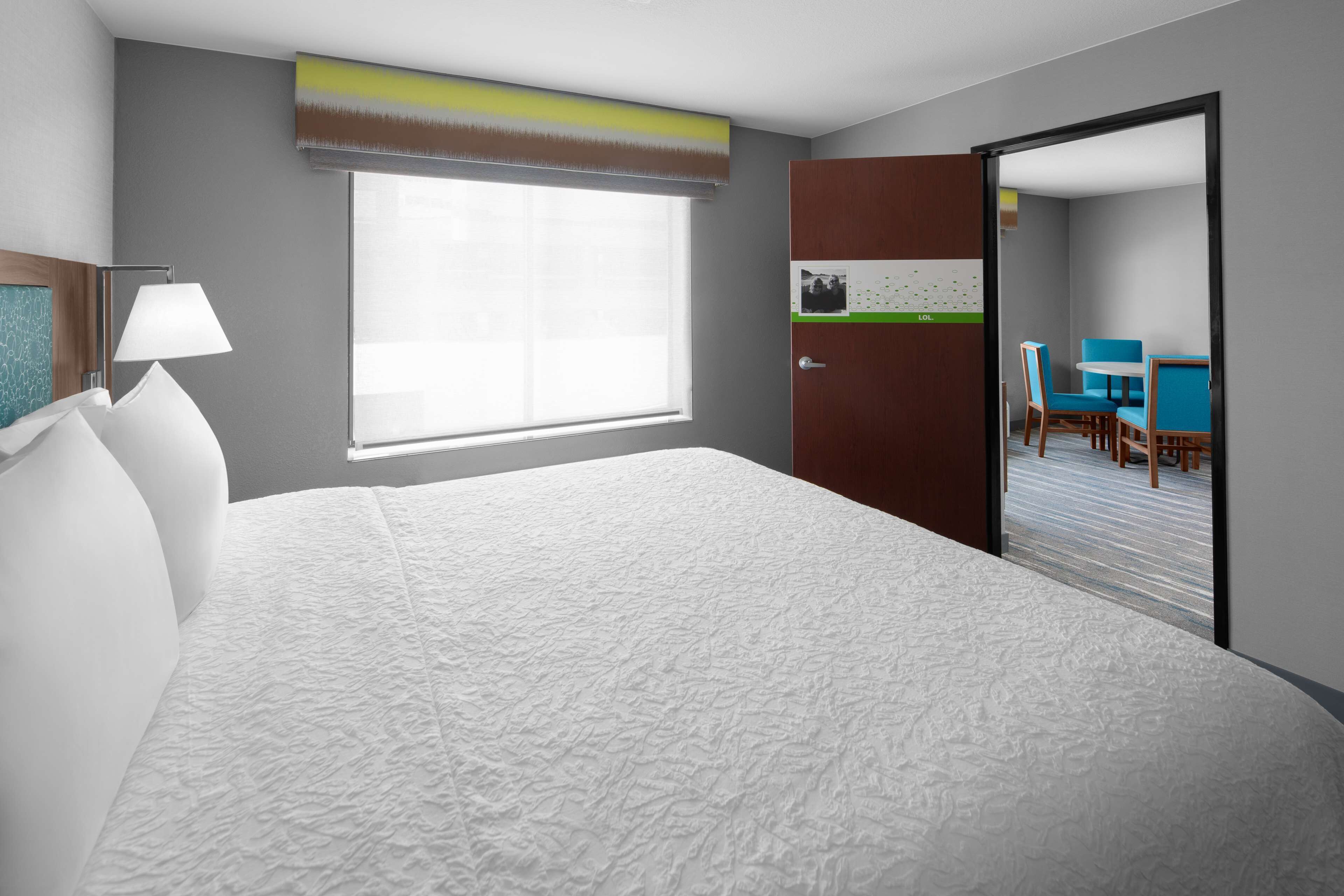 family room | premium bedding, desk, blackout curtains, iron/ironing board