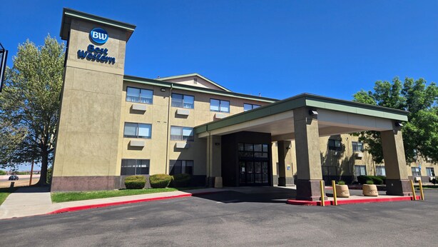 A hotel with a prominent 'Best Western' sign, a covered entrance, and a parking lot. - Best Western North I-25 Hotel (Albuquerque)
