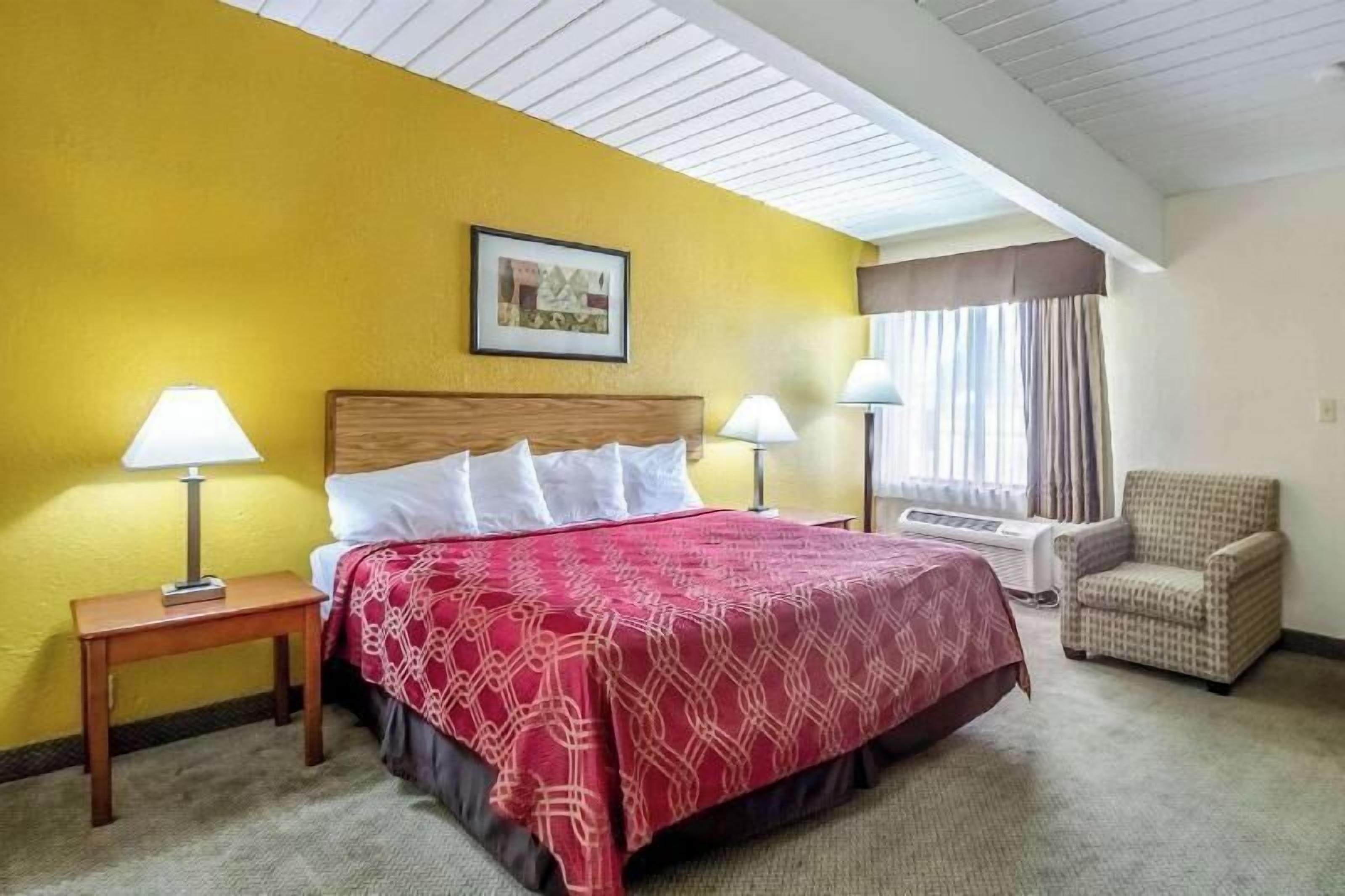 Desk, blackout drapes, iron/ironing board, rollaway beds