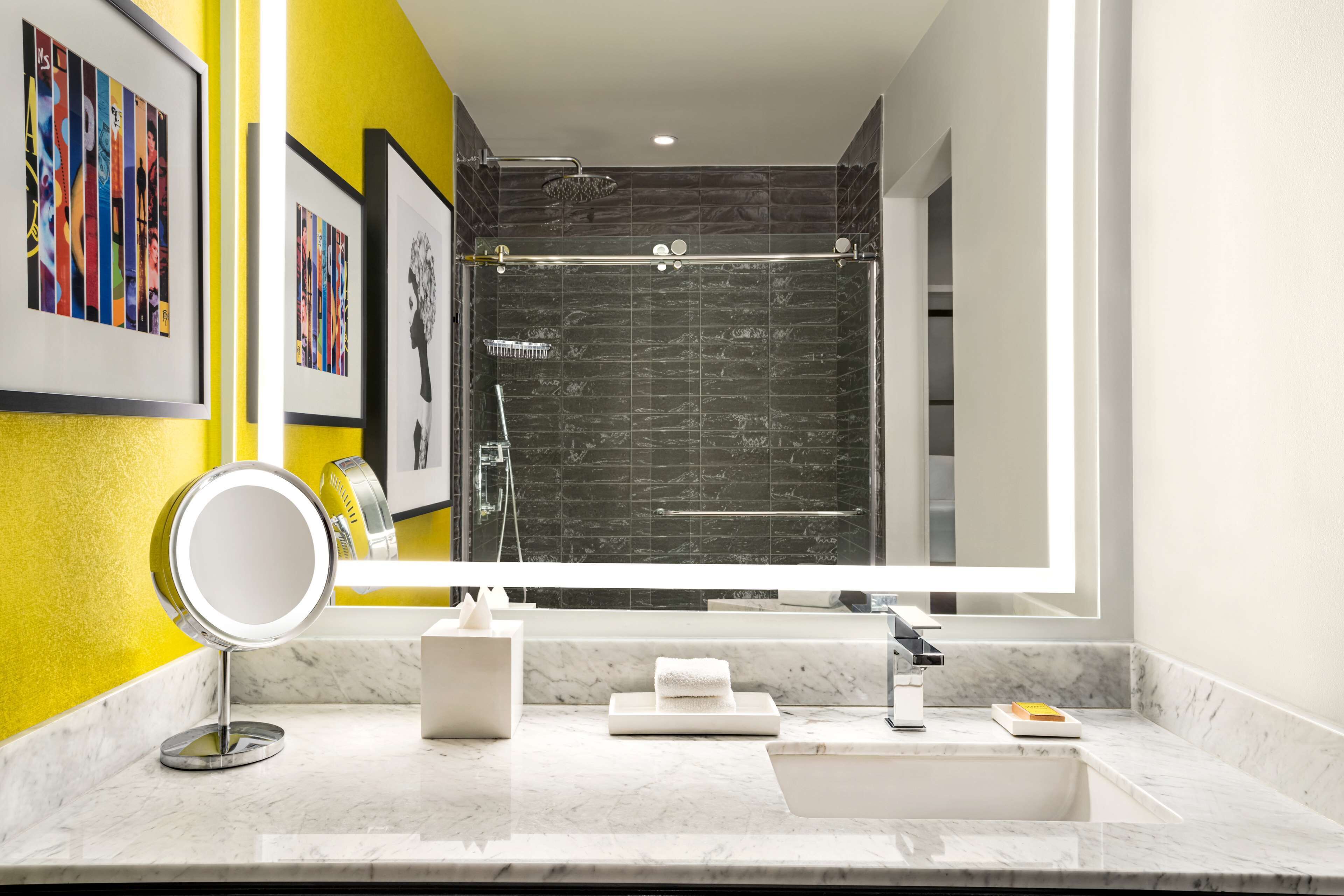 combined shower/bathtub, designer toiletries, hair dryer, bathrobes