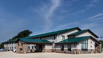 Guests can enter through the central entrance, accessing a covered porch area.