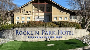 A building with a sign reading "Rocklin Park Hotel" and "The Chalet Event Center." - Rocklin Park Hotel, Trademark Collection by Wyndham (Rocklin)