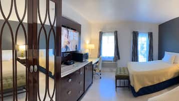 Desk, laptop workspace, blackout drapes, iron/ironing board