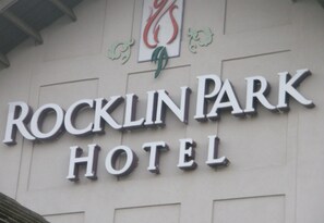 The exterior of Rocklin Park Hotel with its name prominently displayed in large letters. - Rocklin Park Hotel, Trademark Collection by Wyndham (Rocklin)
