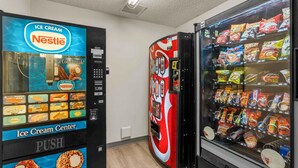 A vending machine area with an ice cream dispenser and a snack vending machine. - Extended Stay America Suites Dallas Plano Parkway (Plano)