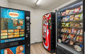A vending machine area with an ice cream dispenser and a snack vending machine. - Extended Stay America Suites Dallas Plano Parkway (Plano)