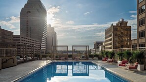 A rooftop pool with lounge chairs and a view of surrounding buildings. - InterContinental San Antonio Riverwalk by IHG (San Antonio)