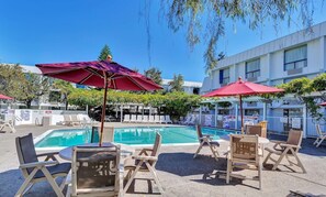 Outdoor pool, open 9:00 AM to 9:00 PM, pool umbrellas, pool loungers