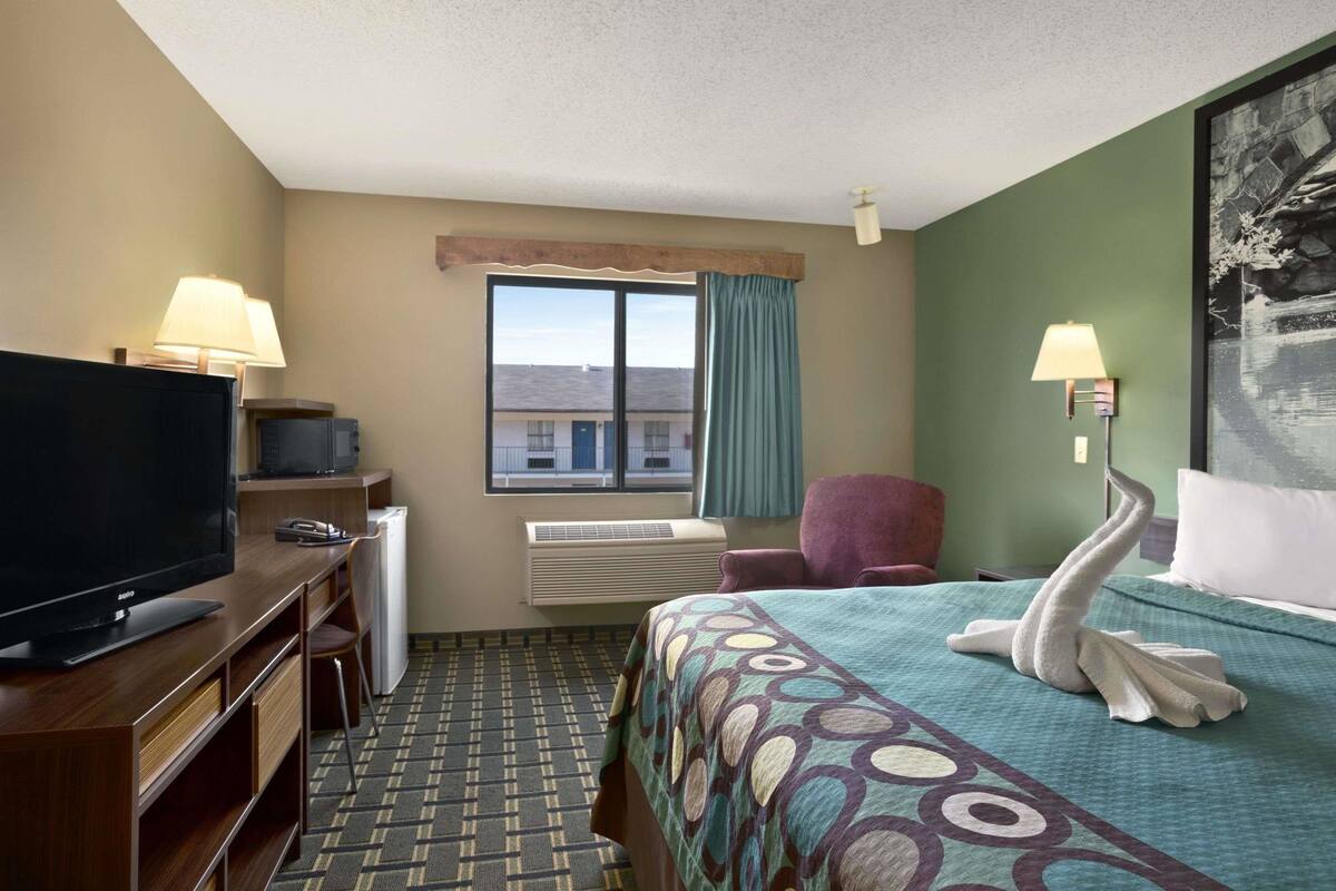Premium bedding, desk, laptop workspace, blackout curtains