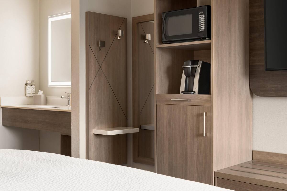 Premium bedding, pillow-top beds, desk, laptop workspace